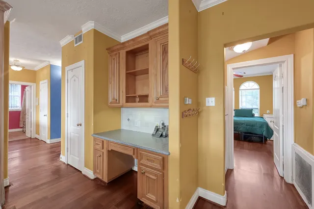 a living room with furniture a rug and a chandelier