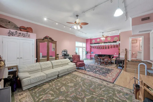 an aerial view of a house with swimming pool and outdoor space
