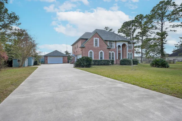 a kitchen with kitchen island granite countertop a stove and a refrigerator