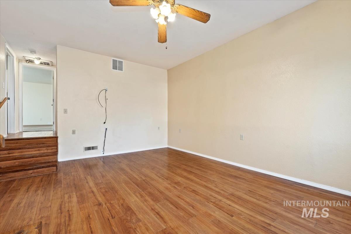 351 East 3rd Street Kuna, ID 83634 - Photo 22 of 42 Spare room with a ceiling fan and light wood-style floors