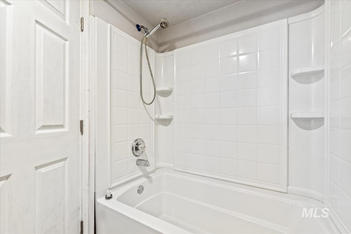 351 East 3rd Street Kuna, ID 83634 - Photo 10 of 42 Bathroom featuring shower / washtub combination