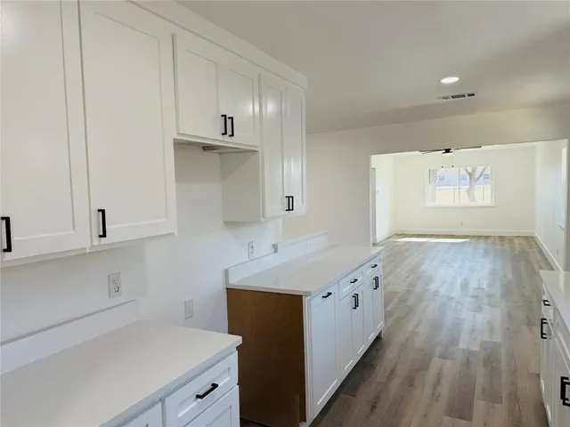 a kitchen with a sink and cabinets