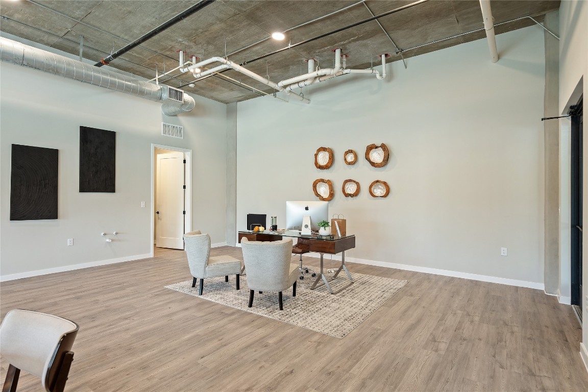 4510 Terry-O Lane, Unit 128 Austin, TX 78745 - Photo 11 of 29 a living room with a wooden floor