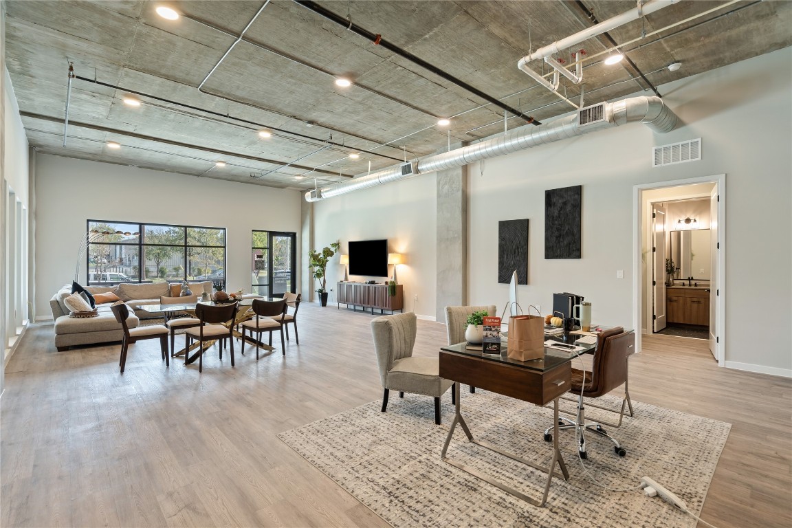 4510 Terry-O Lane, Unit 128 Austin, TX 78745 - Photo 12 of 29 a living room with furniture and a table