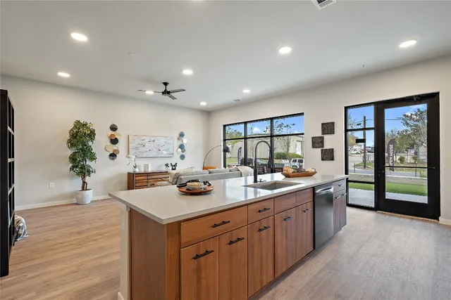 a kitchen with a sink and cabinets