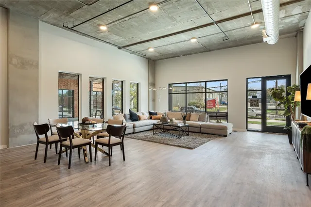 a lobby with furniture and floor to ceiling window