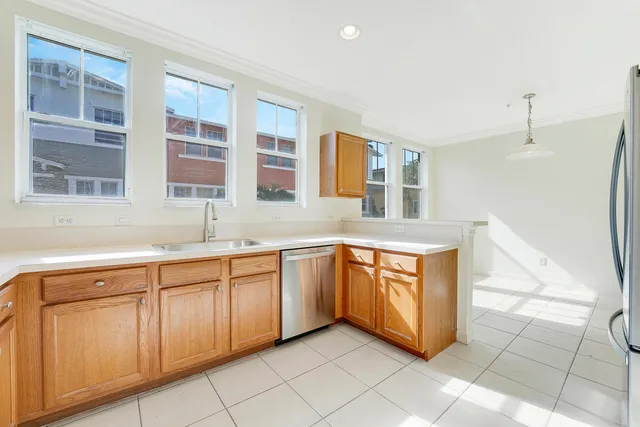 an empty room with windows and entrance