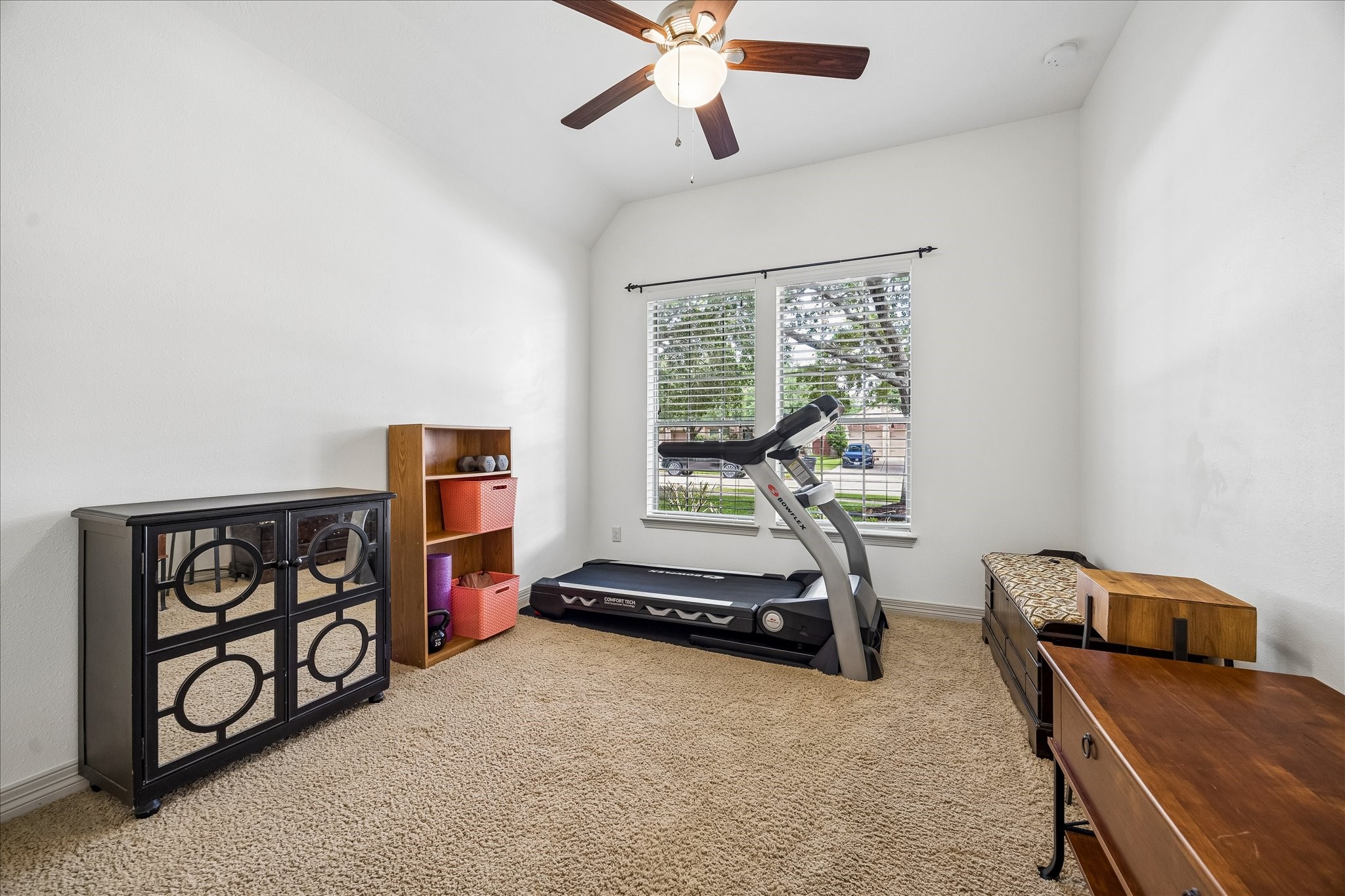 28211 Rippling Brook Lane Fulshear, TX 77441 - Photo 45 of 45 IDEAL SPLIT FLOORPLAN: Privately positioned secondary bedrooms are accessed by a wood-floored hallway and feature oversized front-facing windows with great natural light, ideal for a home office or creative space.