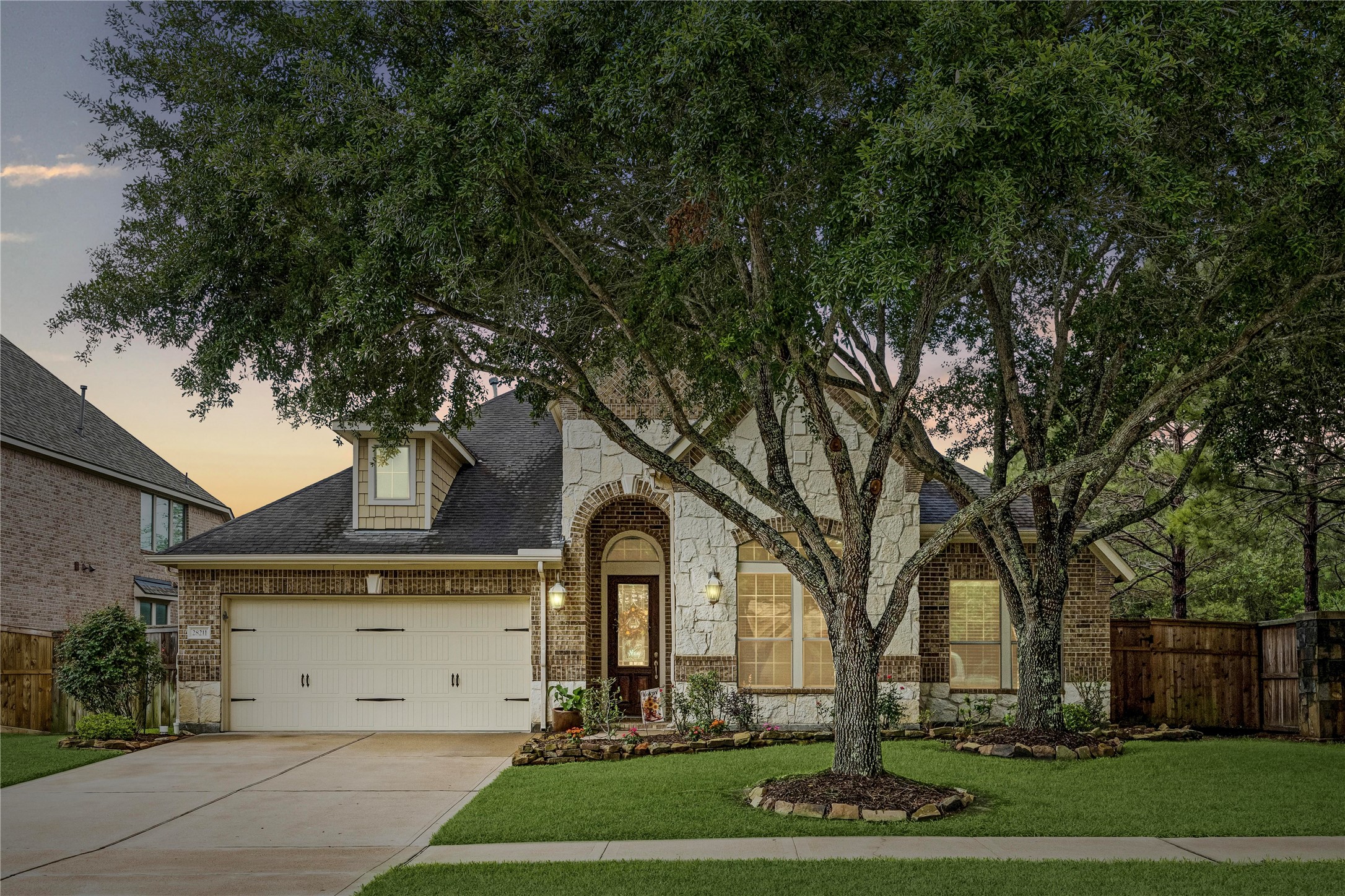 28211 Rippling Brook Lane Fulshear, TX 77441 - Photo 3 of 45 OUTDOOR ENTERTAINING: Expansive covered kitchen and patio set the stage for effortless hosting, complete with space to gather, dine, and unwind year-round.