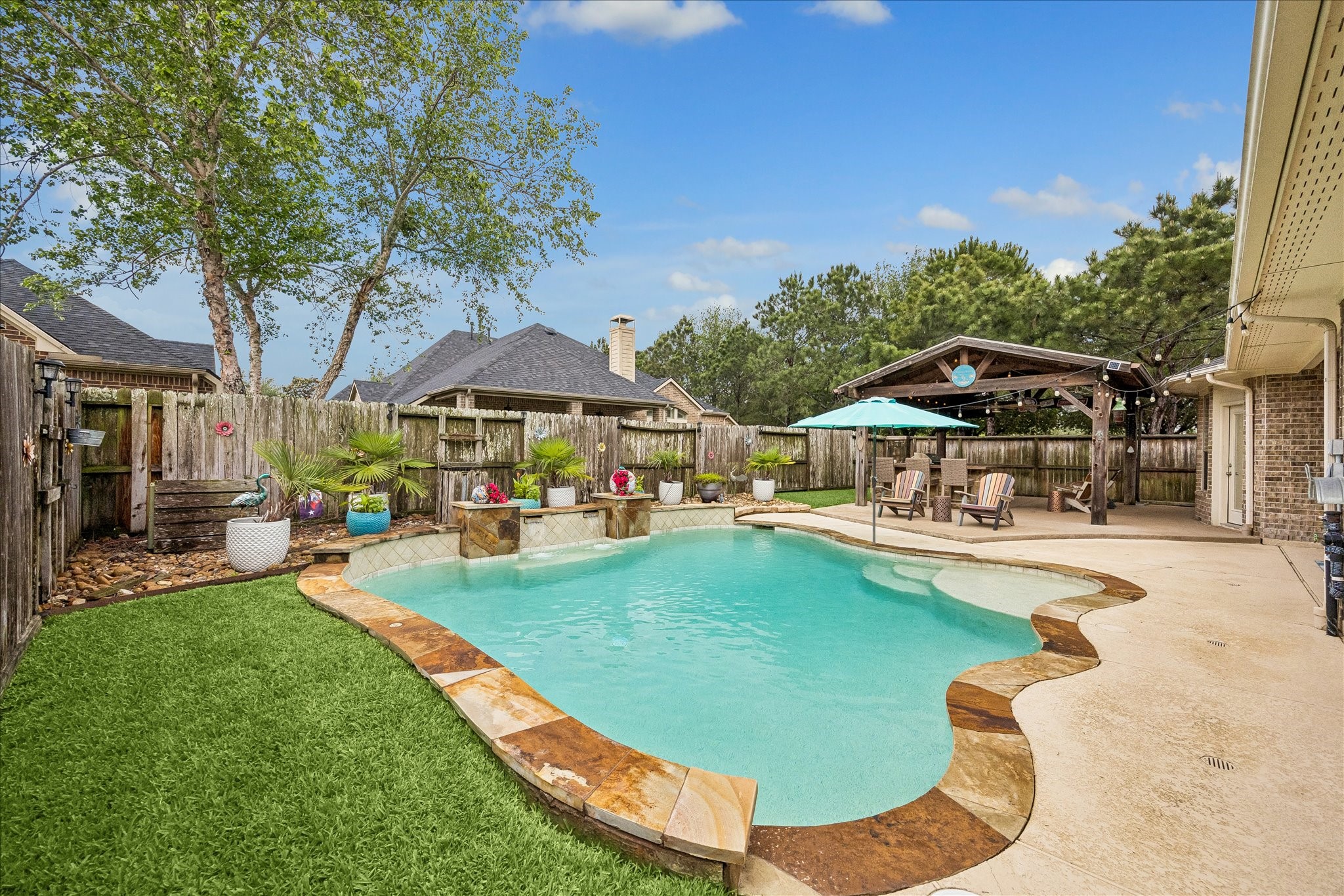 28211 Rippling Brook Lane Fulshear, TX 77441 - Photo 31 of 45 ADDED PRIVACY: Enjoy a peaceful setting with no side neighbors, backing to a wooded greenspace that enhances privacy and outdoor enjoyment.