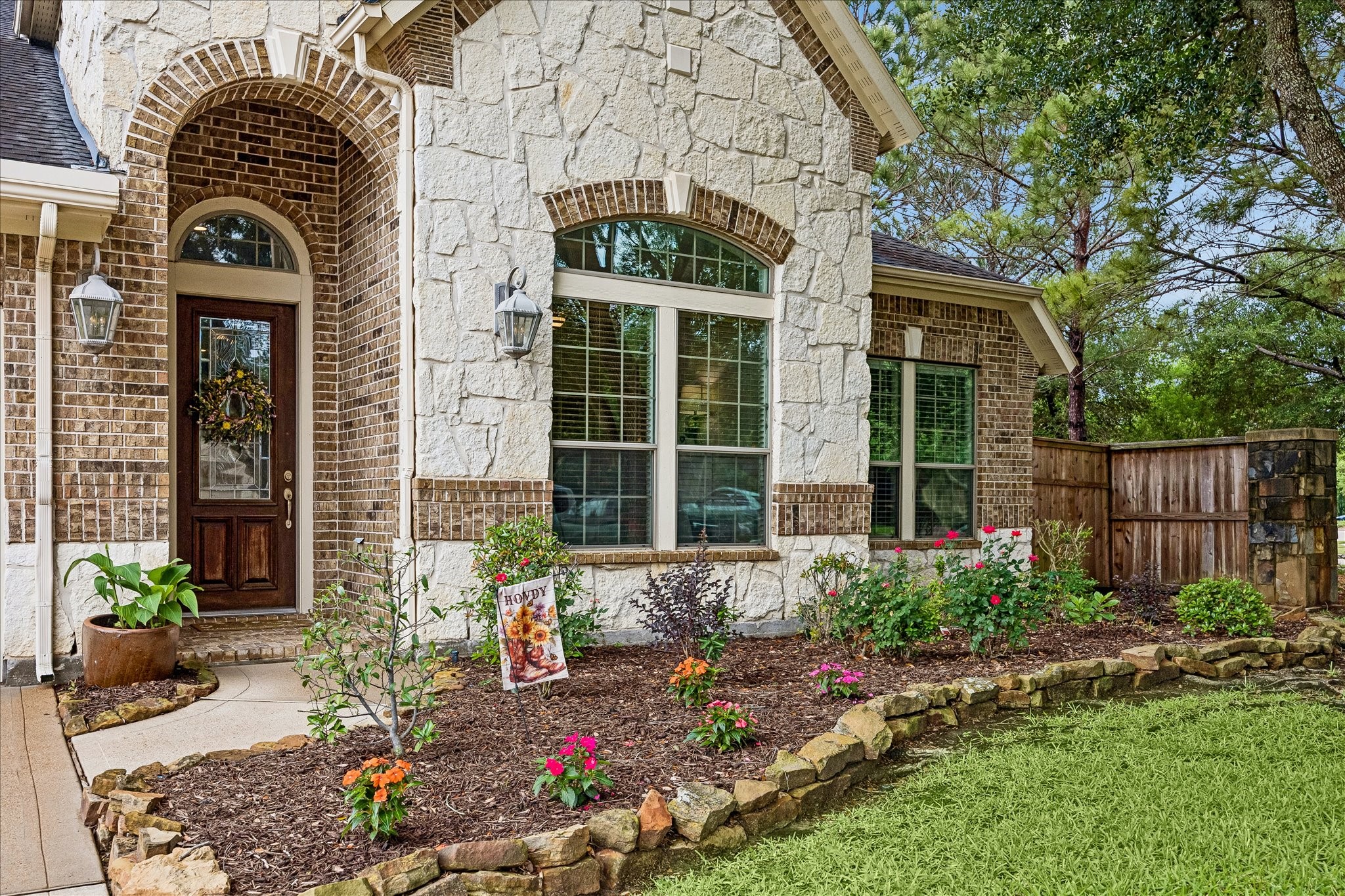 28211 Rippling Brook Lane Fulshear, TX 77441 - Photo 35 of 45 WELCOMING ENTRY: Covered front porch with brick pavers and arched entry creates a warm and inviting first impression.
