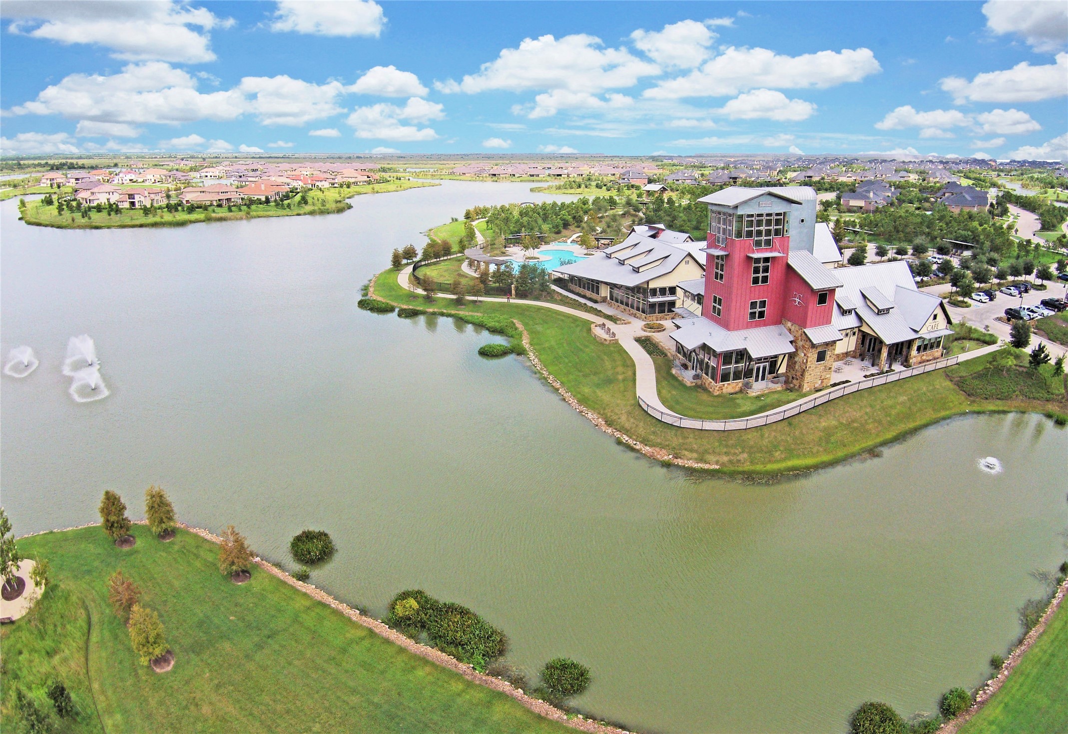 28211 Rippling Brook Lane Fulshear, TX 77441 - Photo 39 of 45 ENDLESS AMENITIES: Expansive resort-style pool, shaded lounging areas, and beautifully designed gathering spaces make this a central hub for relaxation and recreation.
