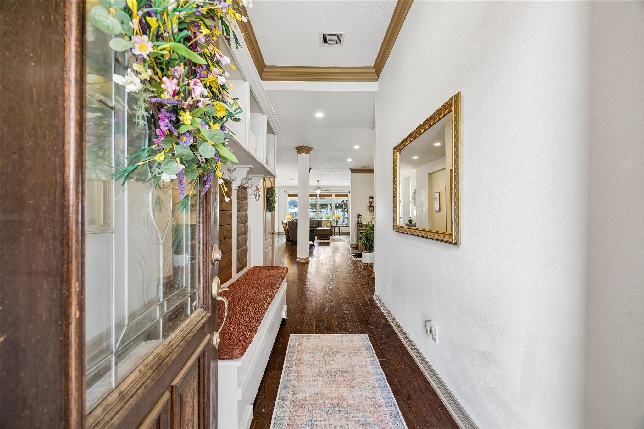 28211 Rippling Brook Lane Fulshear, TX 77441 - Photo 4 of 45 GRAND ENTRY: An 8’ mahogany front door, soaring 11’ ceilings, and rich handscraped wood floors create a warm, elevated first impression.