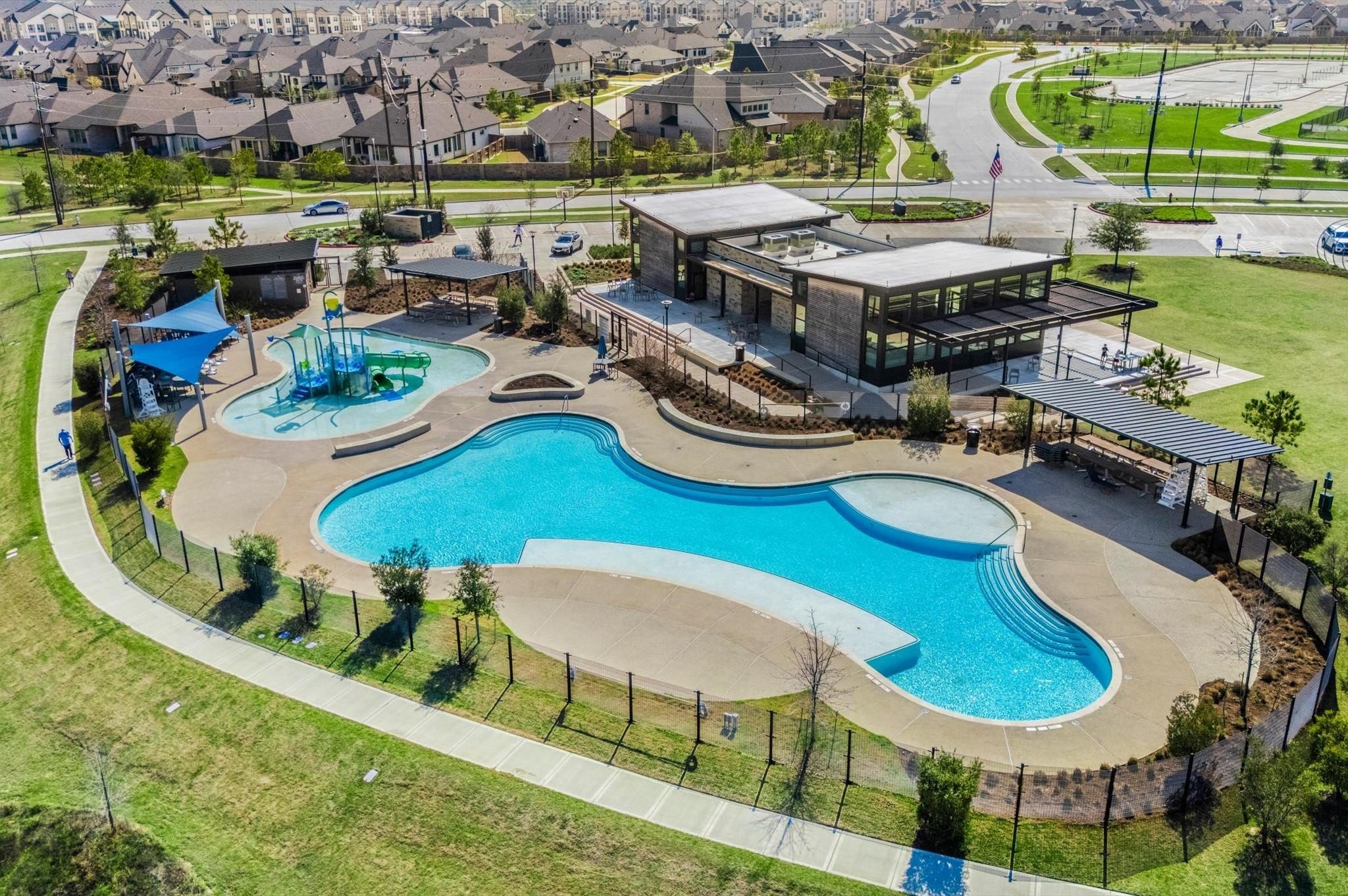 28211 Rippling Brook Lane Fulshear, TX 77441 - Photo 41 of 45 THE LANDING: Featuring a clubhouse, fitness center, resort-style pool, splash pad, tennis courts, and open green space for an elevated lifestyle experience.