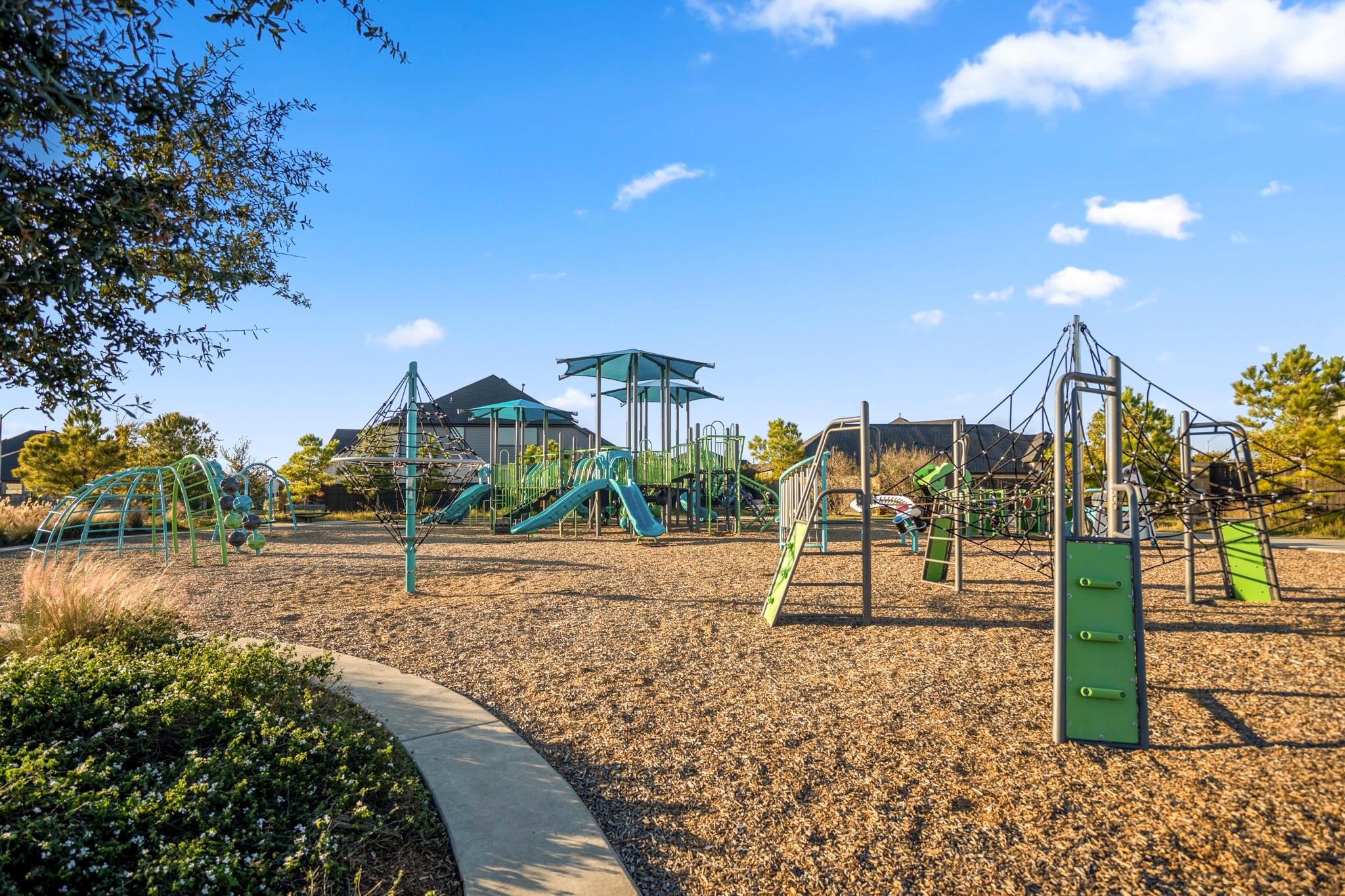 28211 Rippling Brook Lane Fulshear, TX 77441 - Photo 42 of 45 NEIGHBORHOOD PARKS: Multiple playgrounds and green spaces are thoughtfully placed throughout the community, offering spaces to gather, play, and unwind.