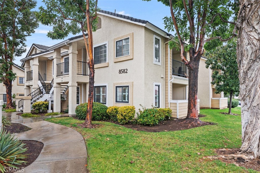 8582 Summerdale Road, Unit 159 San Diego, CA 92126 - Photo 1 of 1 a front view of a house with garden