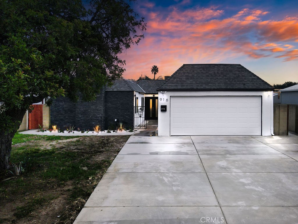 916 North West Street Anaheim, CA 92801 - Photo 1 of 27 a front view of house with yard