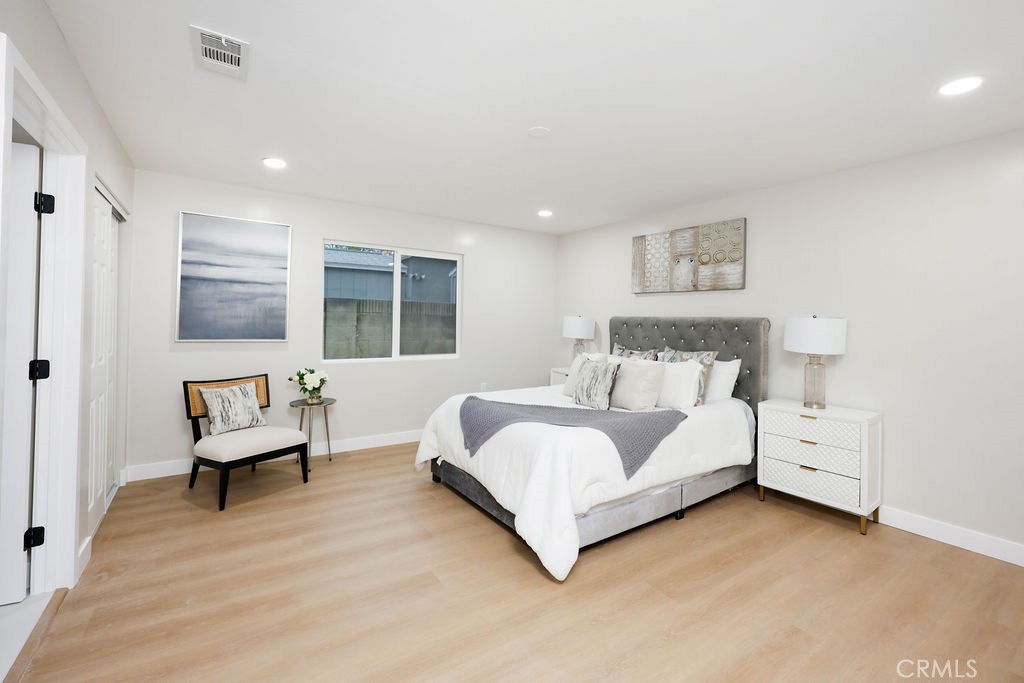 916 North West Street Anaheim, CA 92801 - Photo 15 of 27 a spacious bedroom with a bed and a large window