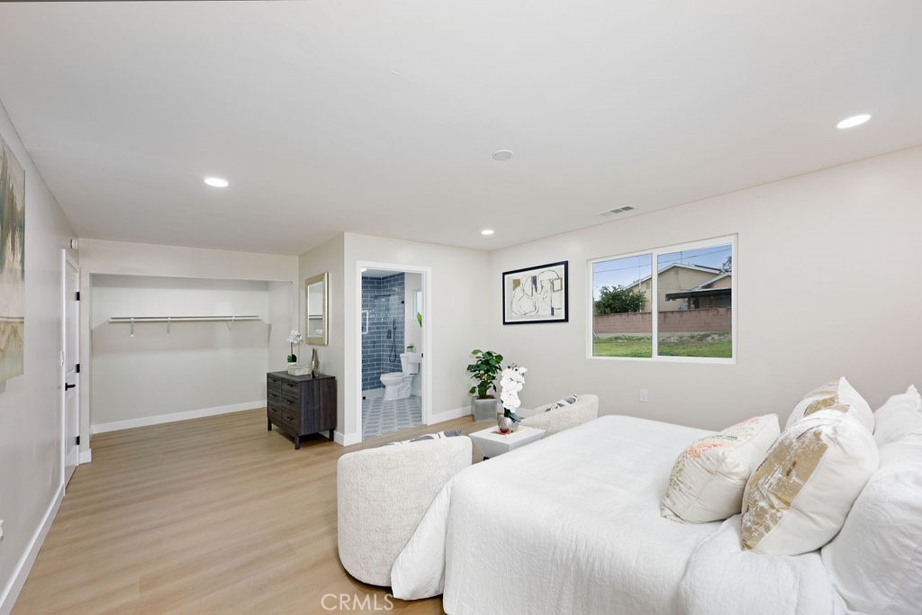 916 North West Street Anaheim, CA 92801 - Photo 19 of 27 a bedroom with a bed and painting on the wall