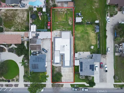 a patio with a table and a barbeque