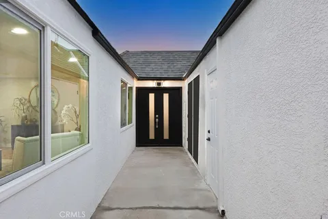 a view of hallway with windows