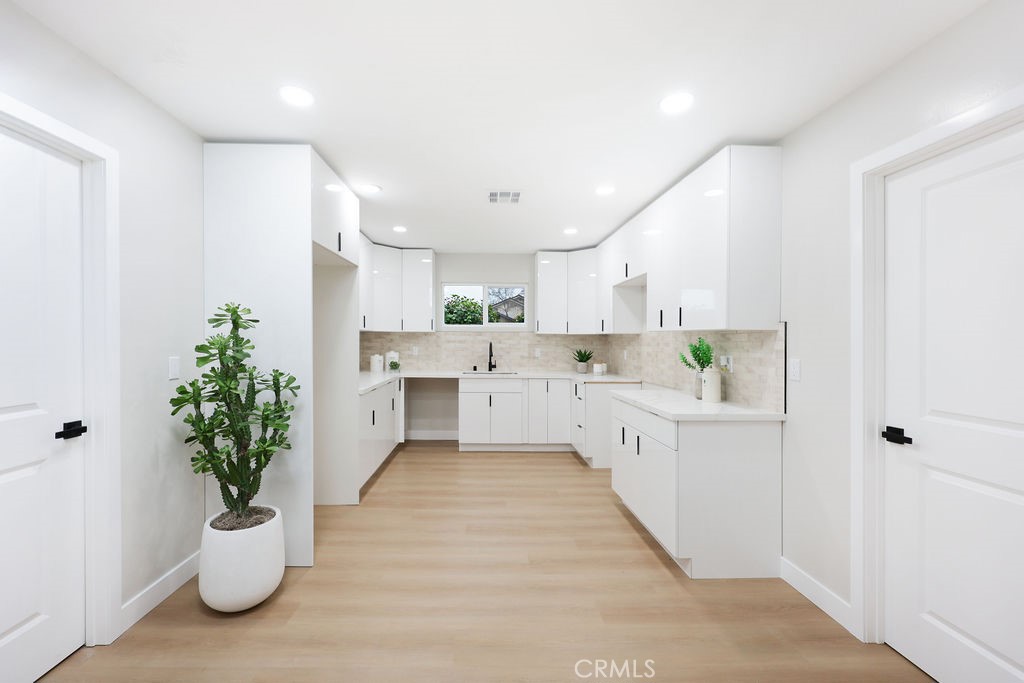 916 North West Street Anaheim, CA 92801 - Photo 8 of 27 a large white kitchen with a white stove