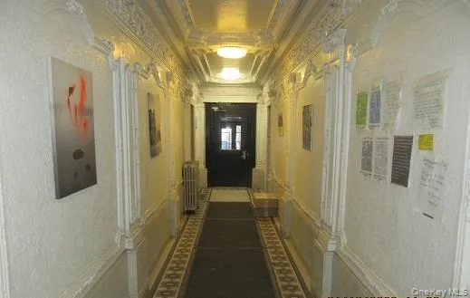 a white toilet sitting in a bathroom next to a window