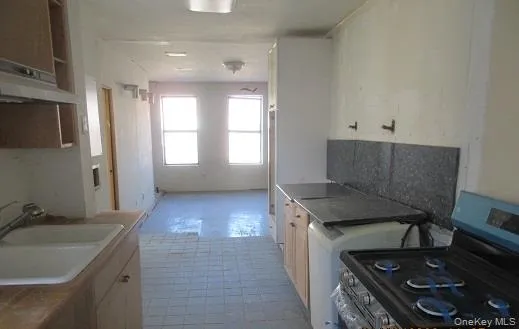 a room with a sink and a mirror