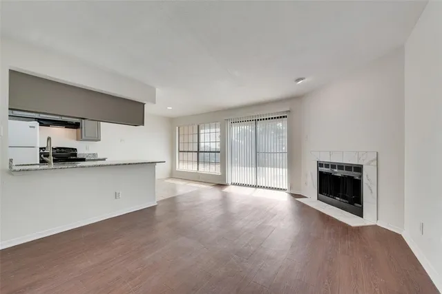 a view of a kitchen with a sink cabinets and a fireplace