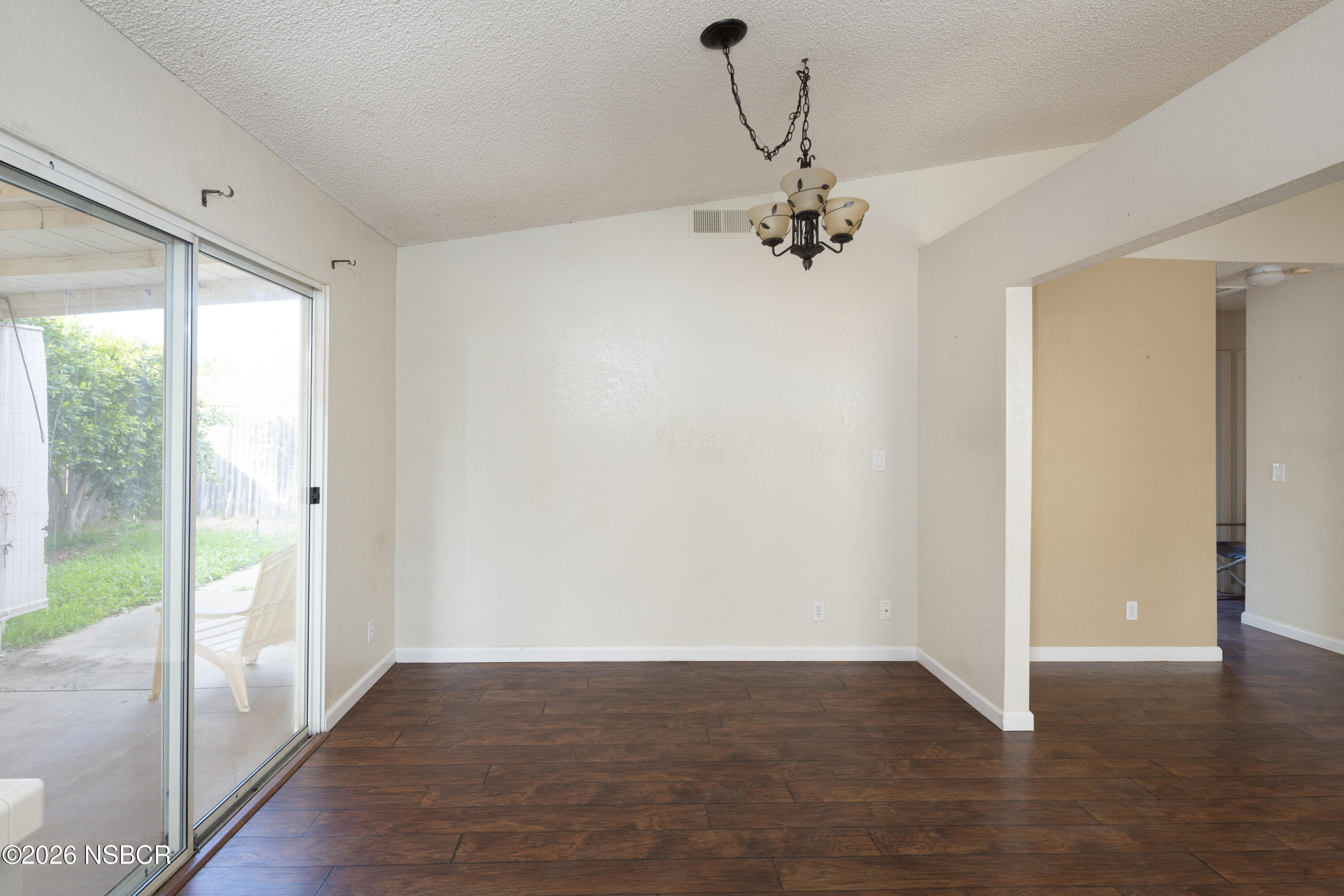 545 Santa Cruz Court Santa Maria, CA 93455 - Photo 14 of 28 wooden floor in an empty room with a window