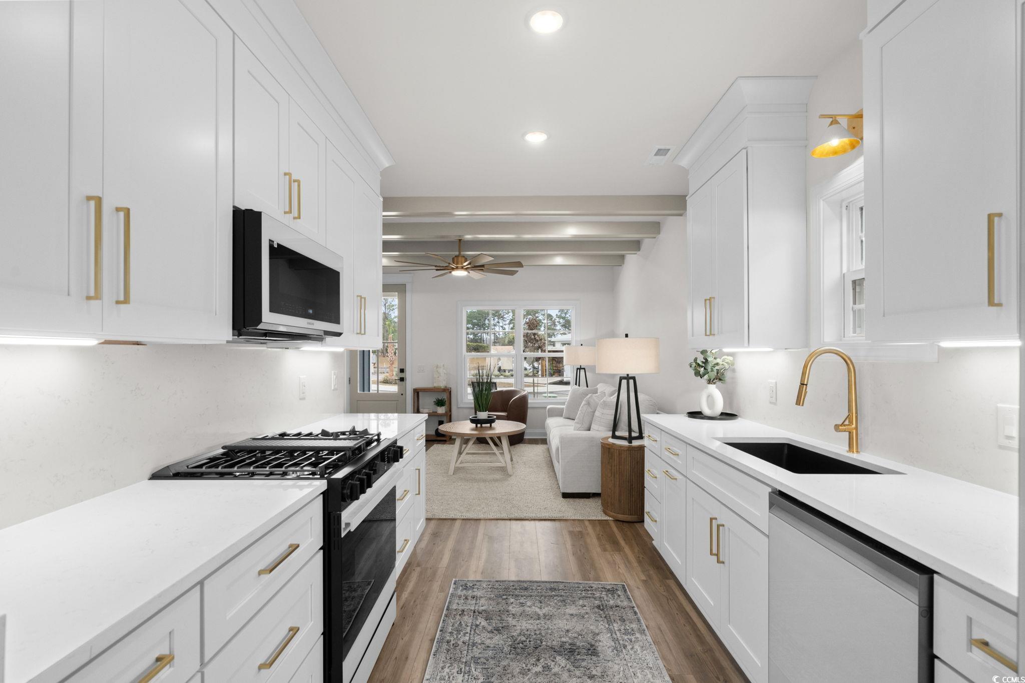 156 Arbor Ridge Circle Conway, SC 29526 - Photo 40 of 40 Kitchen featuring black range with gas stovetop, open floor plan, light stone counters, dishwasher, and white cabinets