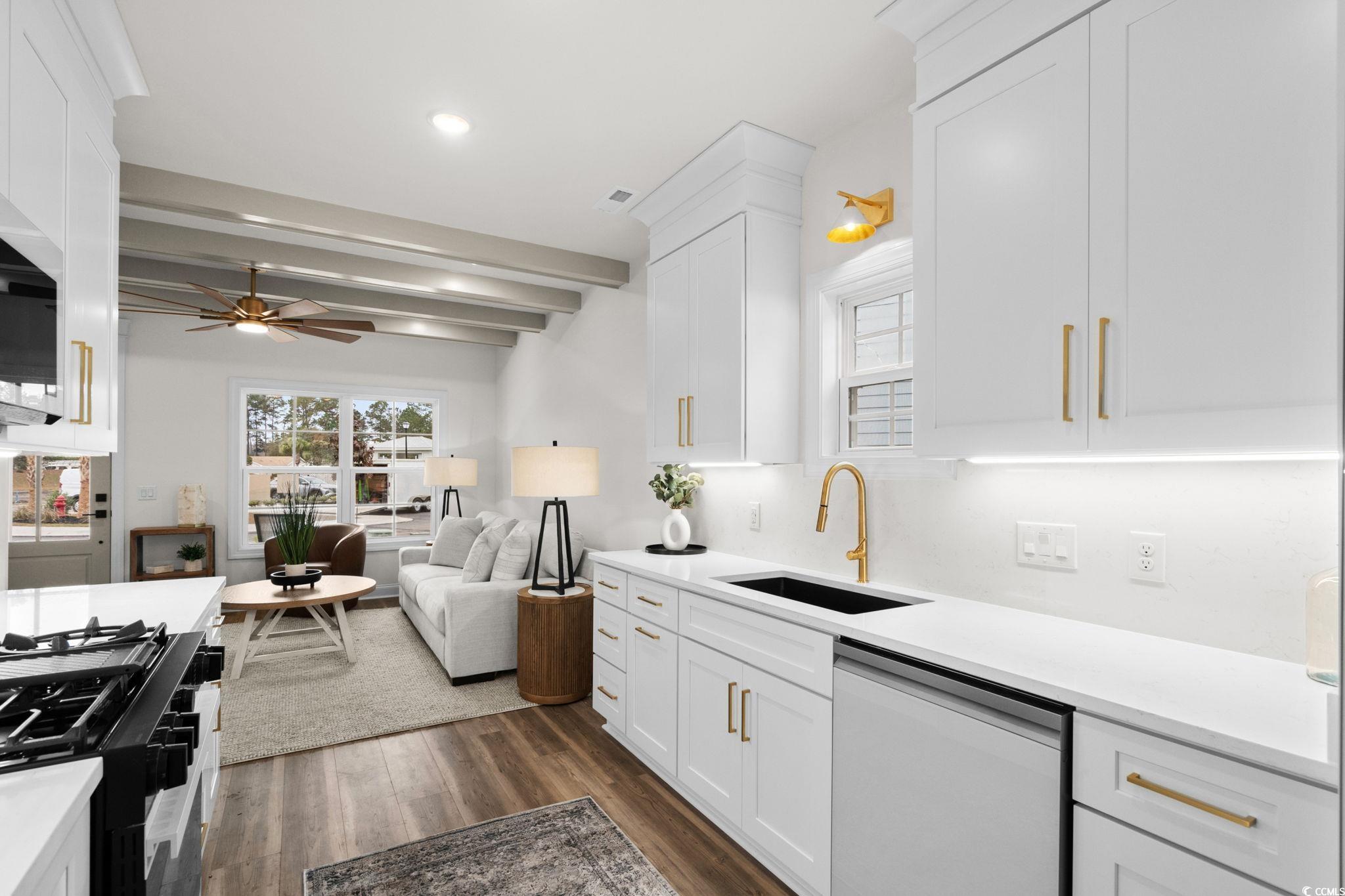 156 Arbor Ridge Circle Conway, SC 29526 - Photo 12 of 40 Kitchen with white appliances, plenty of natural light, beam ceiling, white cabinets, and dark wood finished floors