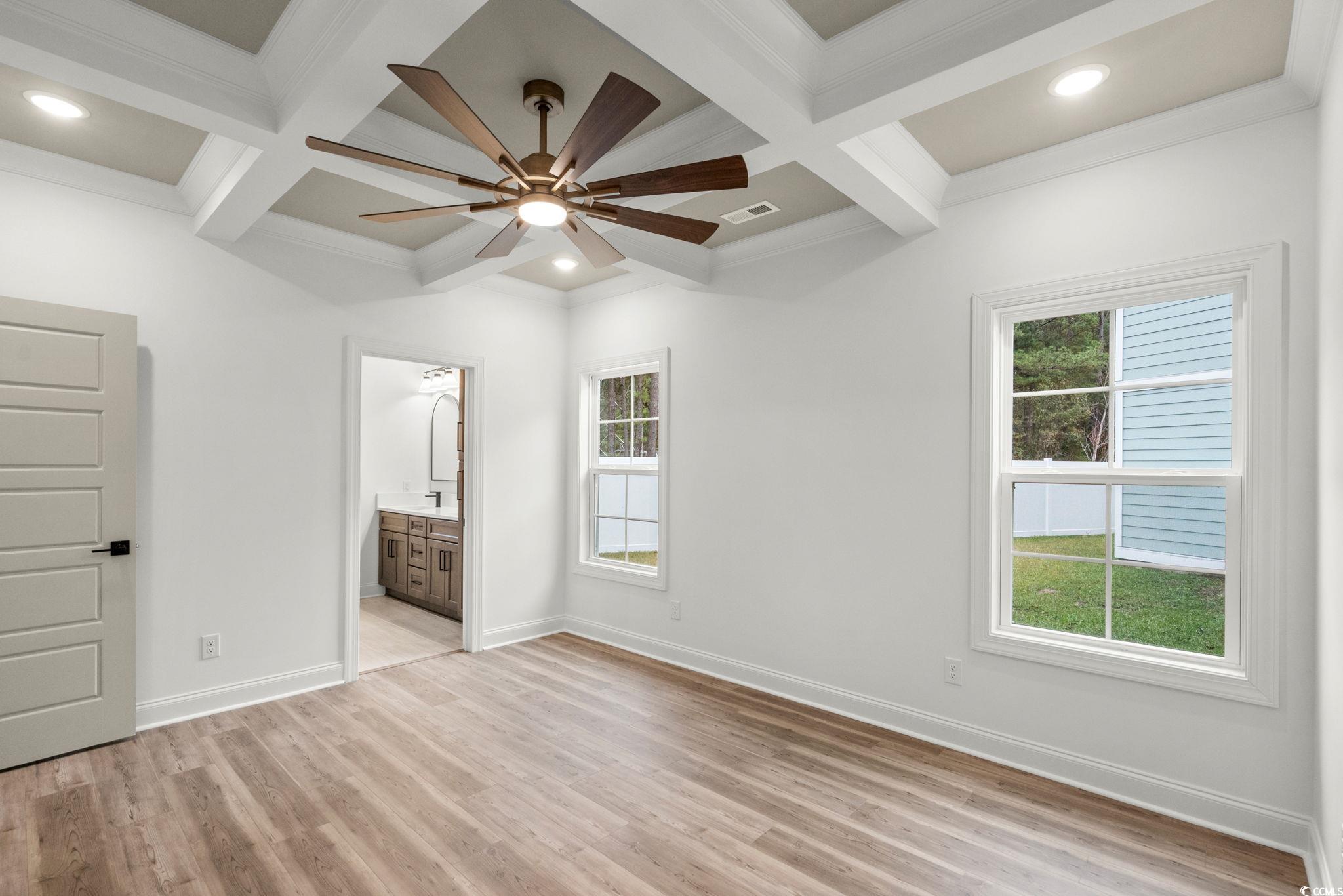 156 Arbor Ridge Circle Conway, SC 29526 - Photo 22 of 40 Unfurnished bedroom with coffered ceiling, beam ceiling, light wood finished floors, ceiling fan, and ornamental molding
