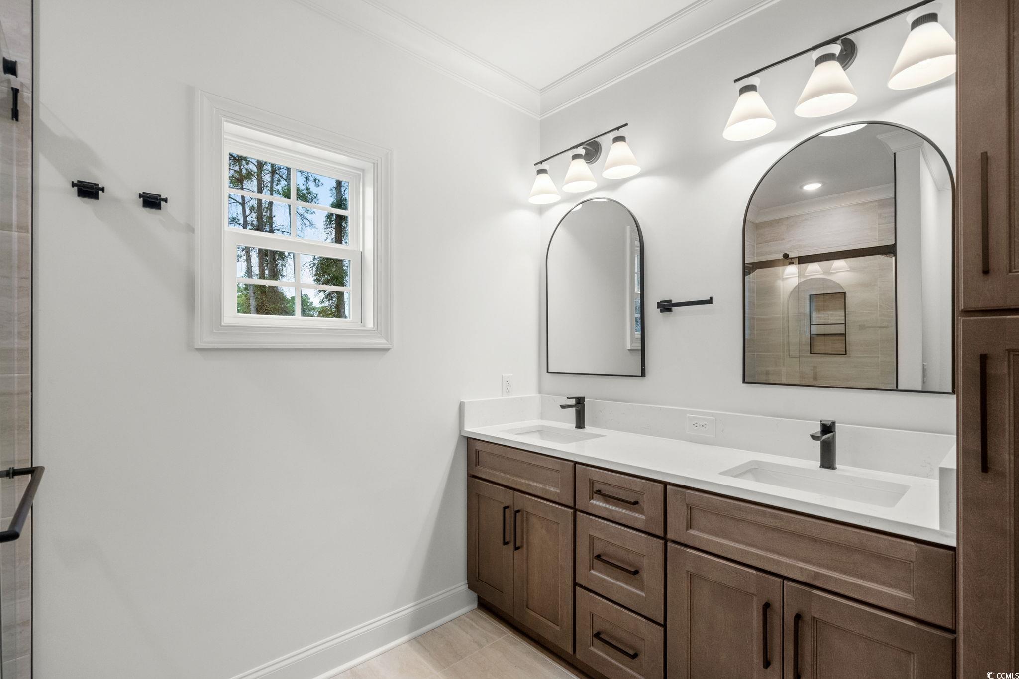 156 Arbor Ridge Circle Conway, SC 29526 - Photo 24 of 40 Full bath featuring a stall shower, double vanity, and ornamental molding