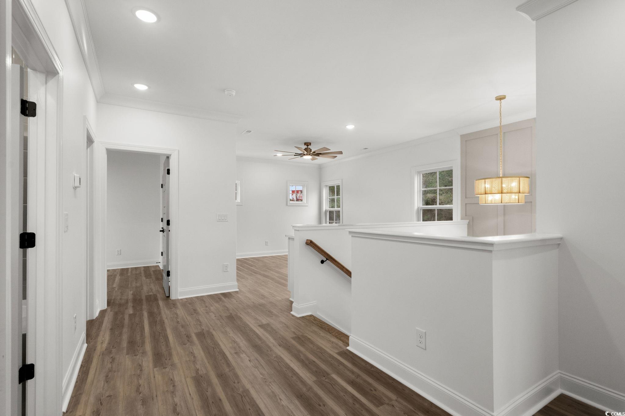 156 Arbor Ridge Circle Conway, SC 29526 - Photo 27 of 40 Corridor featuring an upstairs landing, recessed lighting, dark wood finished floors, and ornamental molding