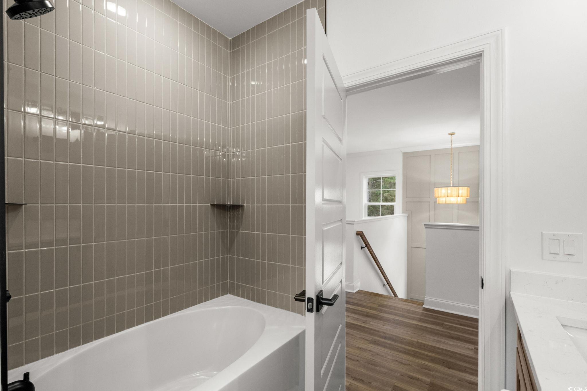 156 Arbor Ridge Circle Conway, SC 29526 - Photo 33 of 40 Full bath with vanity, tub / shower combination, and dark wood-style floors