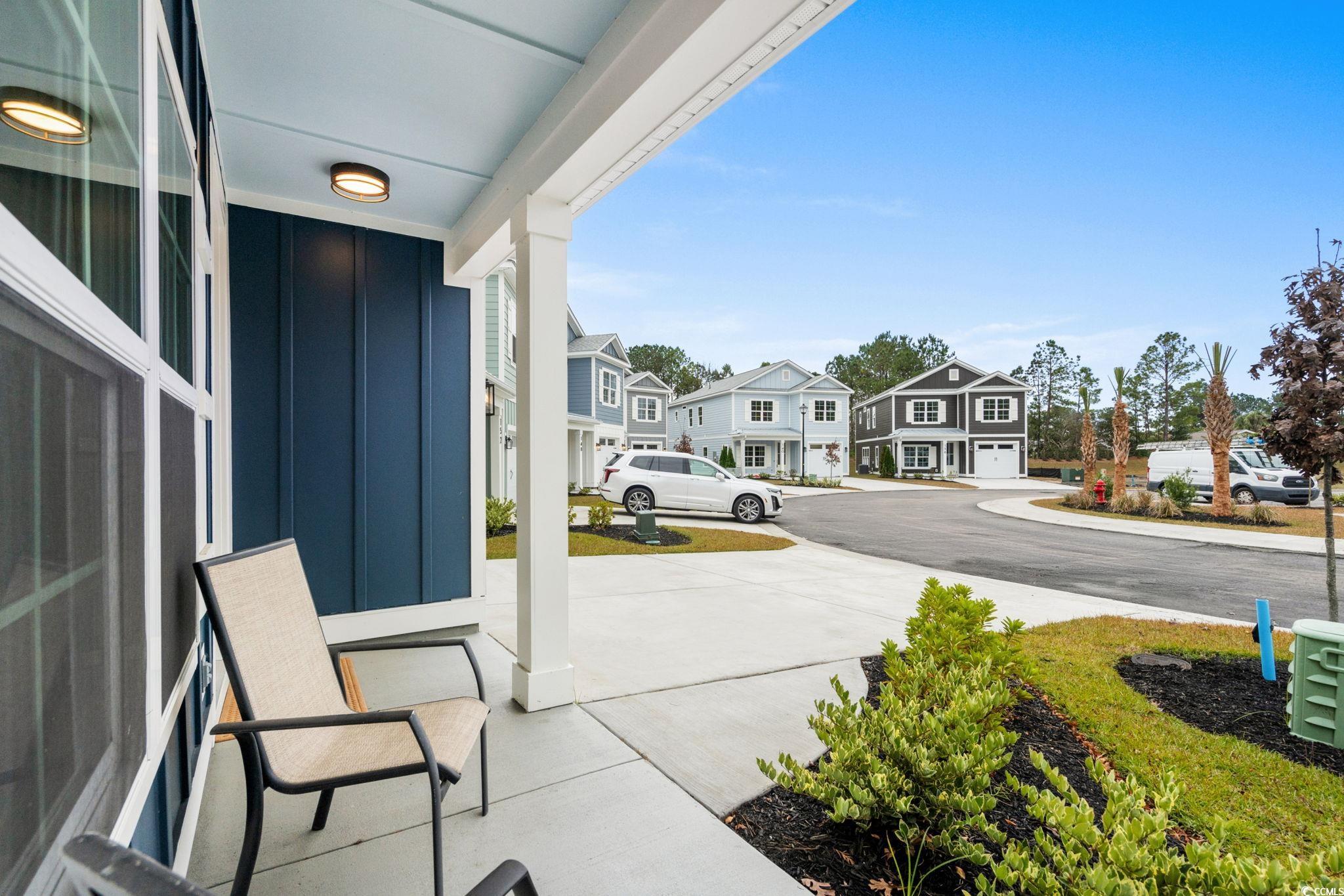 156 Arbor Ridge Circle Conway, SC 29526 - Photo 4 of 40 Covered porch featuring a residential view