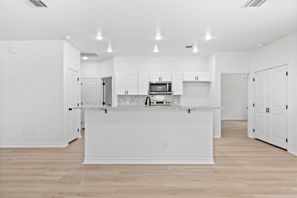 506 2nd Street Moody, TX 76557 - Photo 13 of 40 a white cabinets and refrigerator