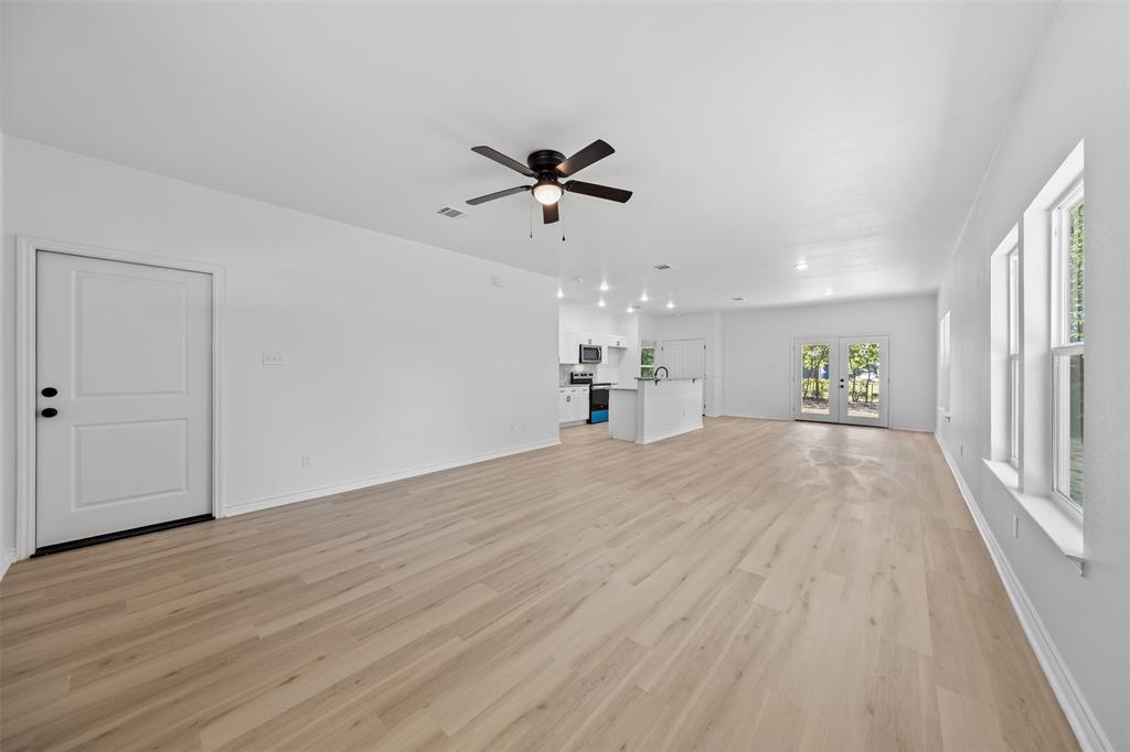 506 2nd Street Moody, TX 76557 - Photo 7 of 40 wooden floor in an empty room with a window