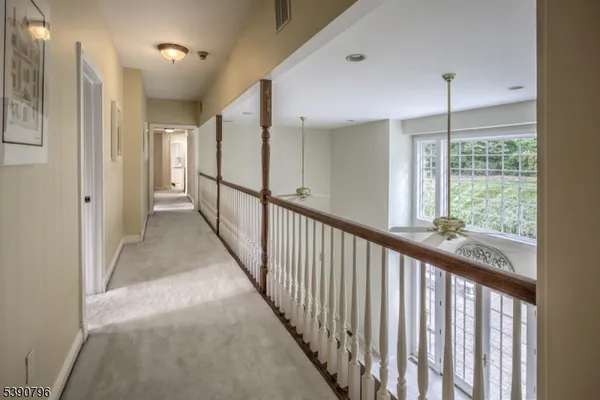 a view of a hallway with windows