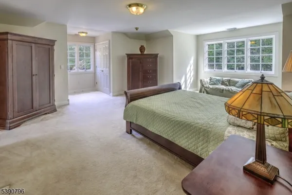 a bed room with a bed and a window