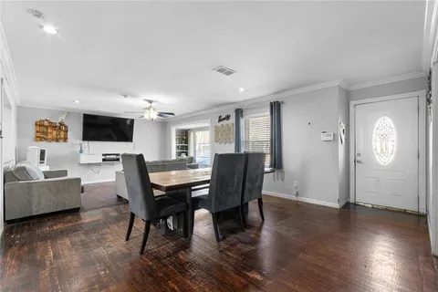 a view of a livingroom with furniture and a flat screen tv