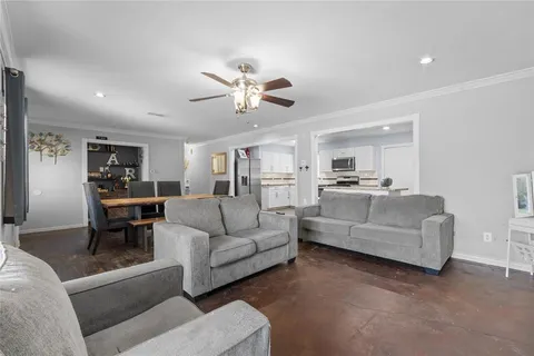 a living room with furniture white walls and white walls