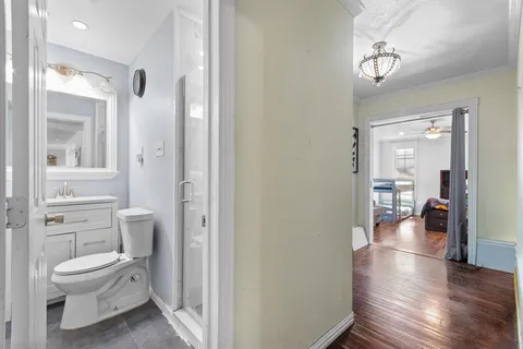 a bathroom with a toilet and a shower