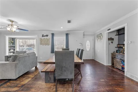 a view of a dining room with furniture window and wooden floor