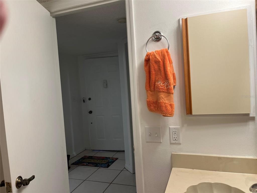 23465 Harbor View Road, Unit 1006 Punta Gorda, FL 33980 - Photo 26 of 41 a bathroom with a sink and mirror