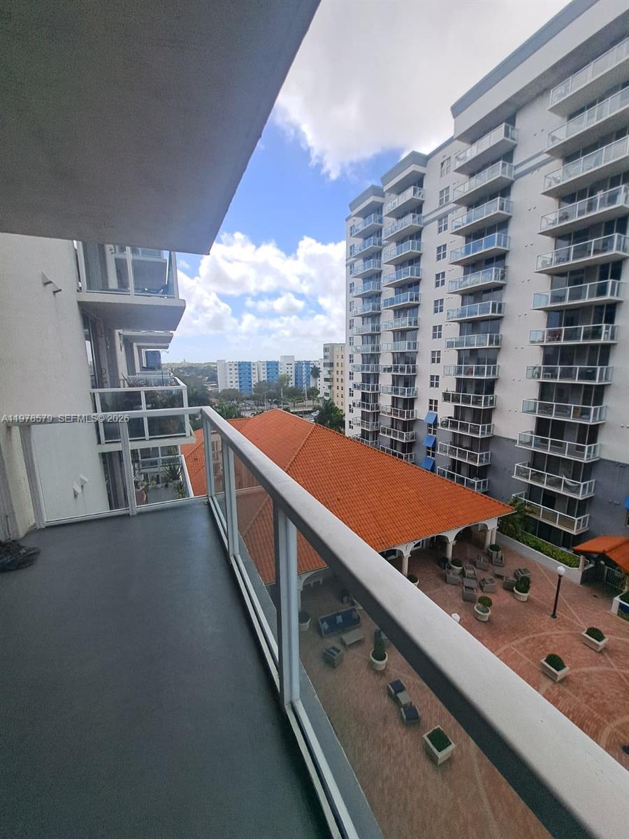 5077 Northwest 7th Street, Unit 912 Miami, FL 33126 - Photo 7 of 28 a view of balcony with furniture