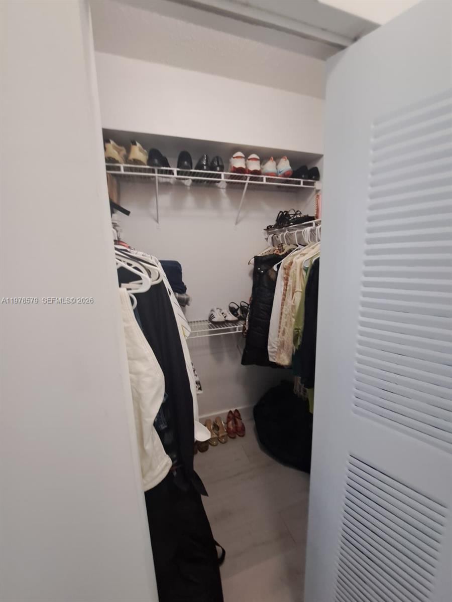5077 Northwest 7th Street, Unit 912 Miami, FL 33126 - Photo 10 of 28 a view of walk in closet