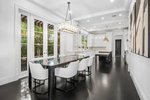 a living room with lots of furniture and a large window