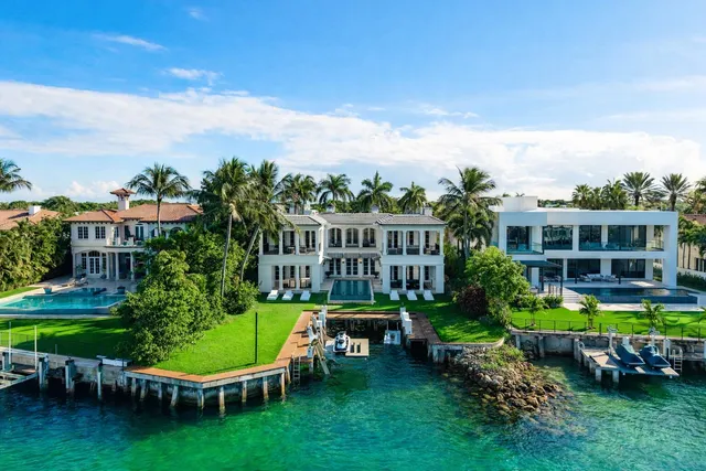 a view of a patio with couches and table and chairs and garden